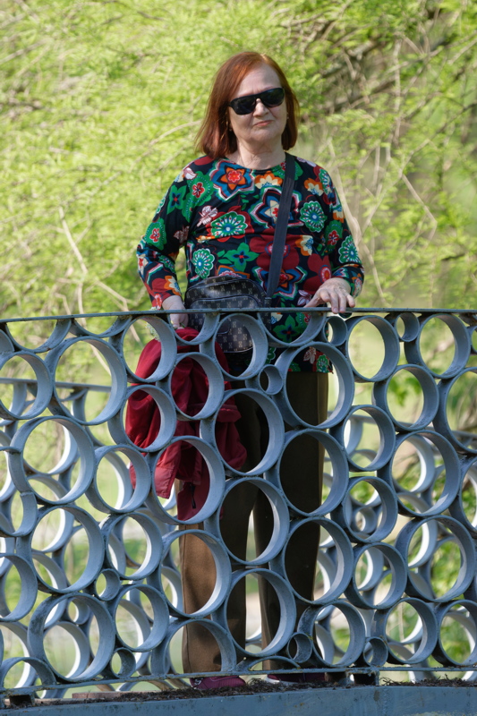 Adult woman on a metal bridge
